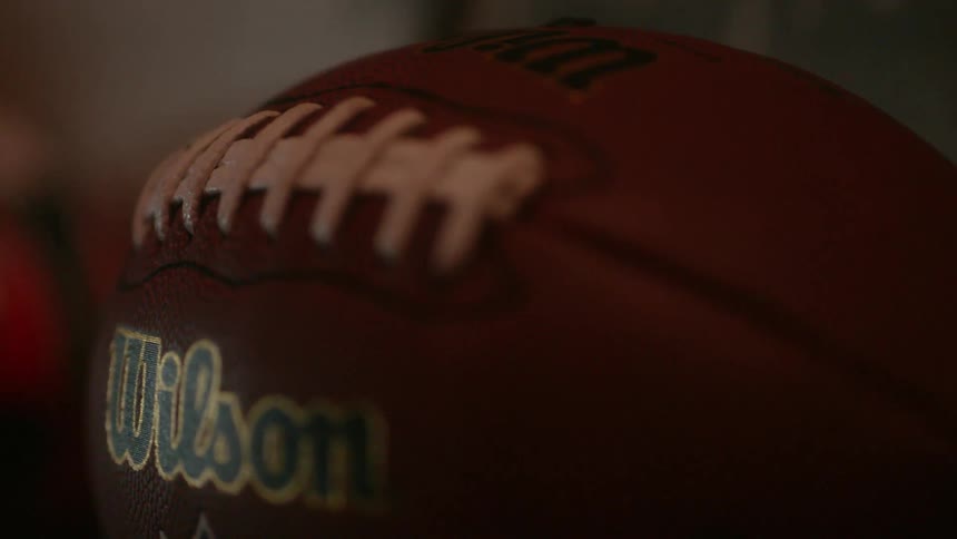 A single football has Wilson written on the side