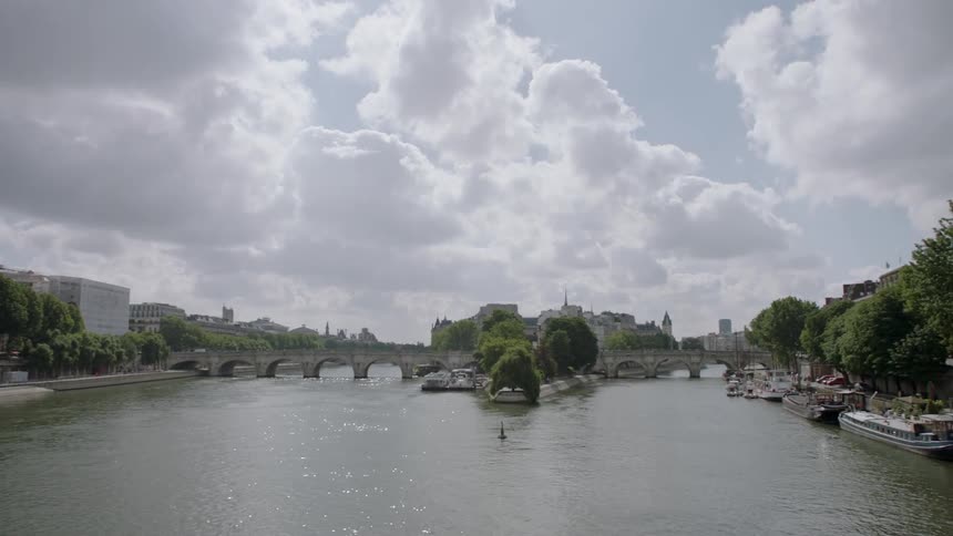 A bridge over a lake on a cloudy day