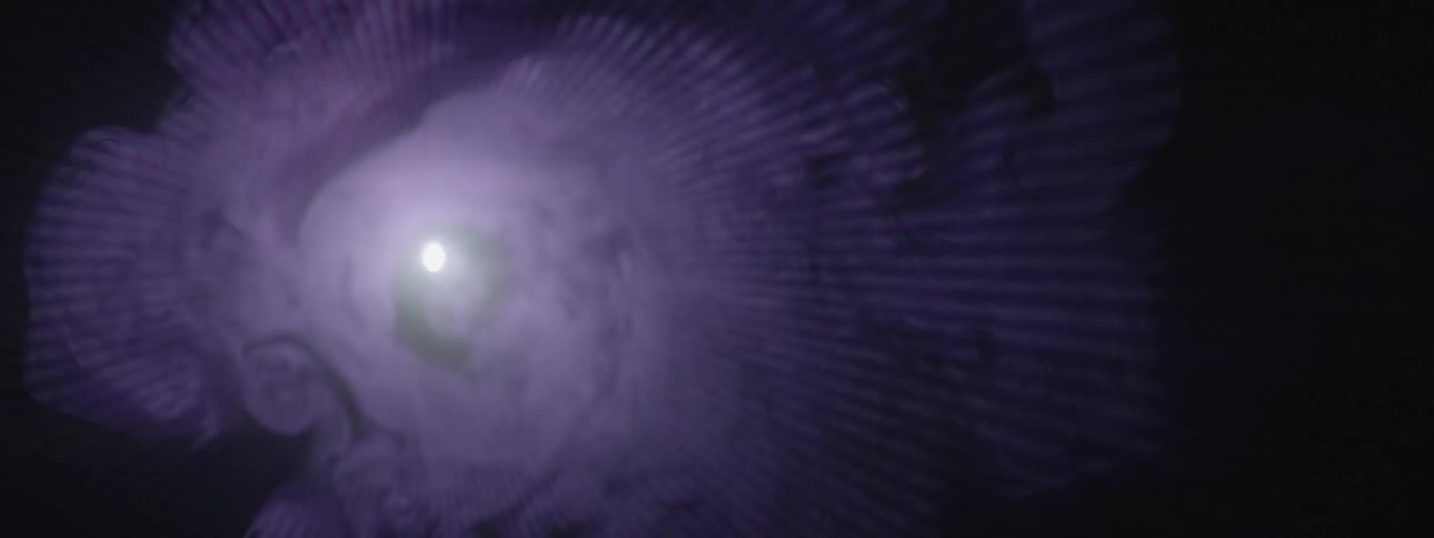 Purple haze fills a room illuminated by a light