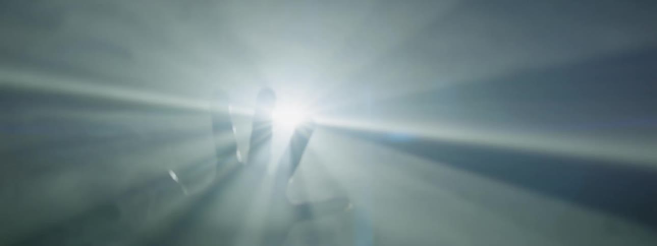 Lights shine on a hand in a smoky area