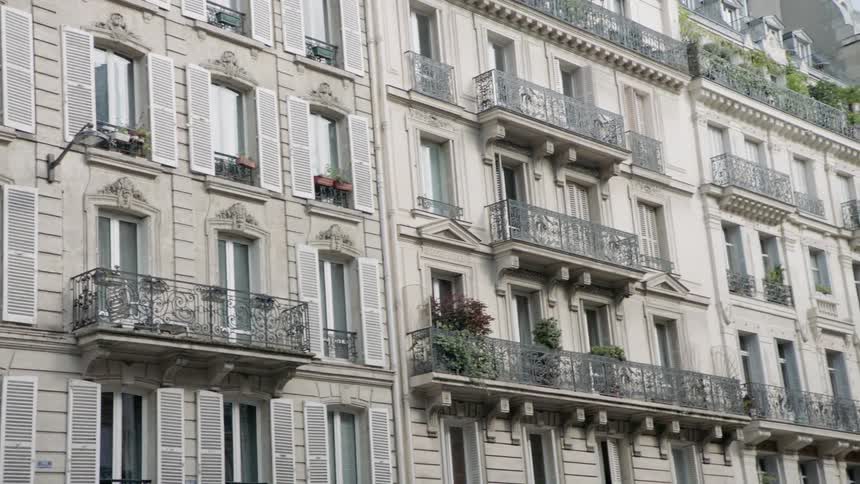 Windows and balconies cover a building