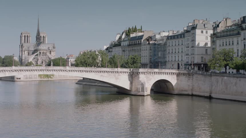 Water flows beneath a city bridge