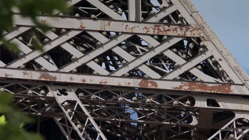People walking in a metal tower
