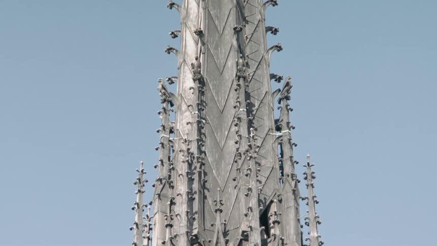 A church steeple is shown on a clear day