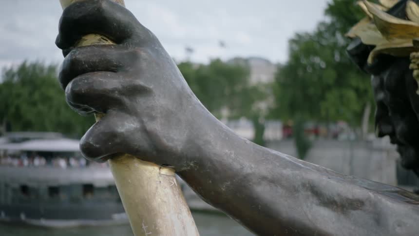 A statue holds a torch