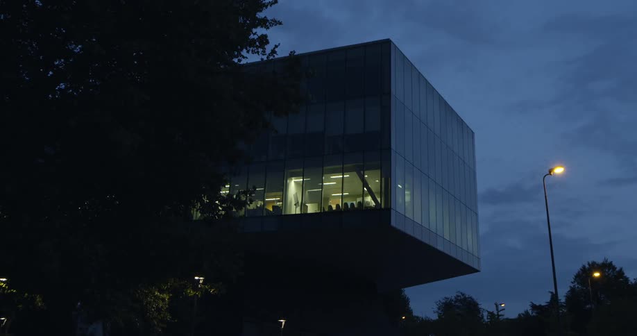 Lights are shining inside an office building at night