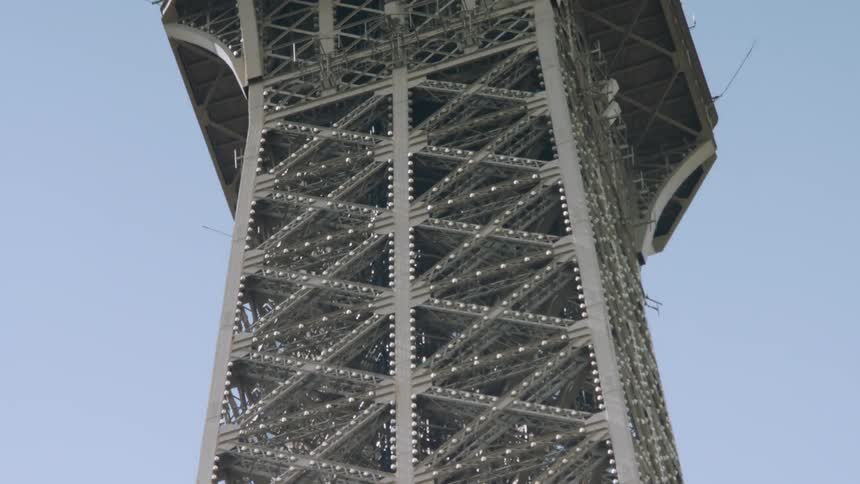 Tall building with metal object on top