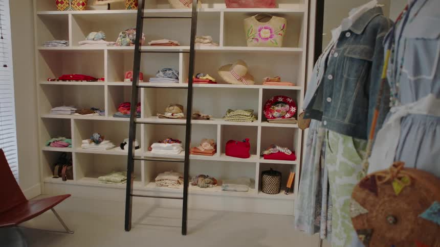 Clothes are for sale in a boutique shop