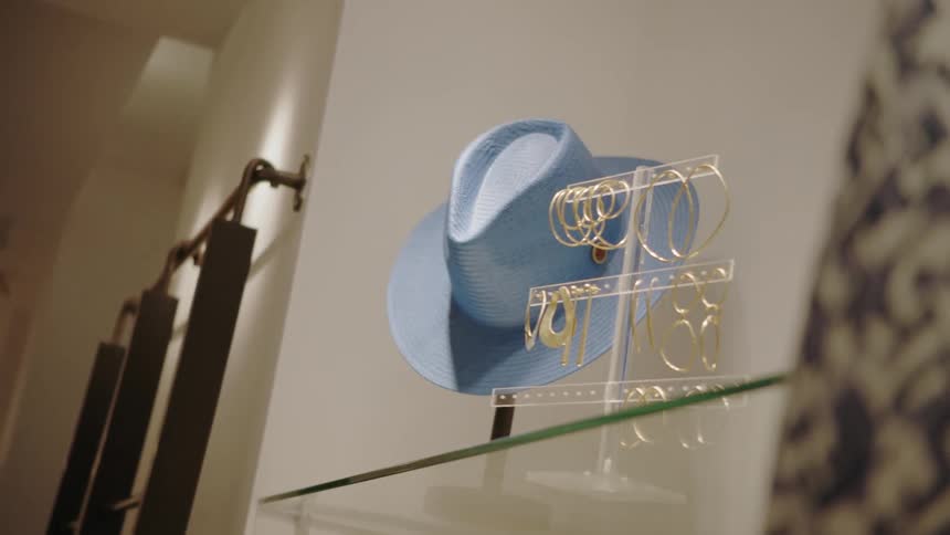 Hat and jewelry on a rack in a store