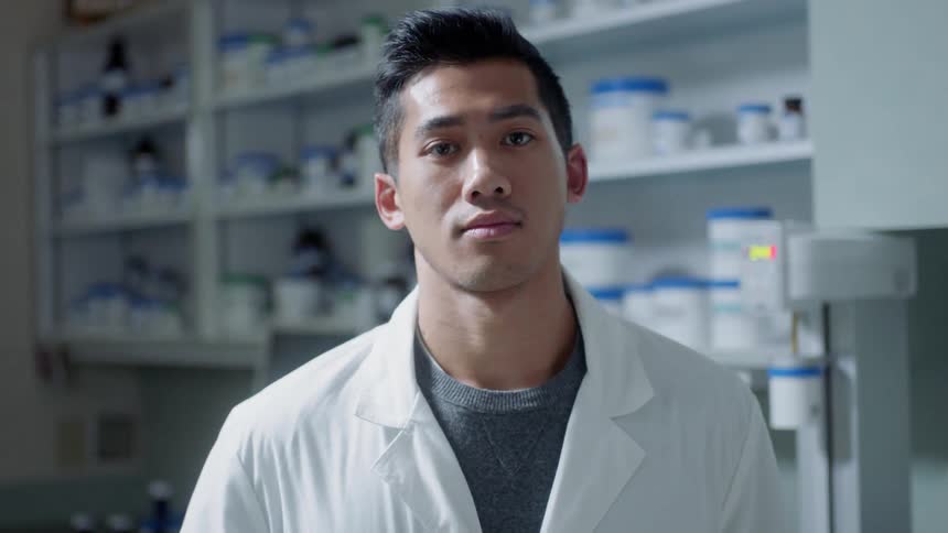 A scientist stands in a lab