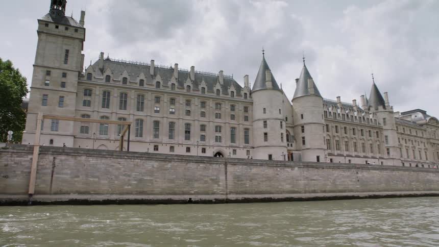 River water flows in front of buildings