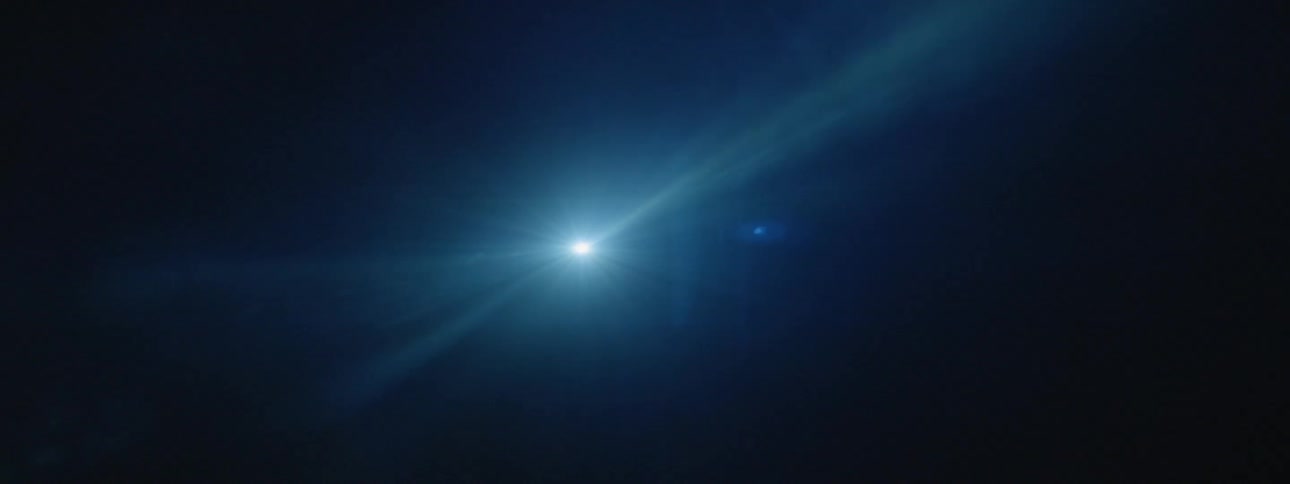 Smoke floats in front of a strobe light