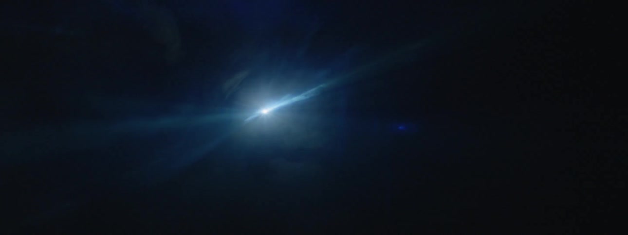 Smoke floats in front of strobe lights in the dark