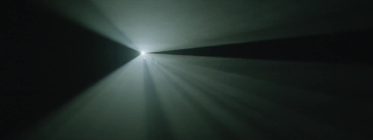 A strobe light shines on an outstretched hand