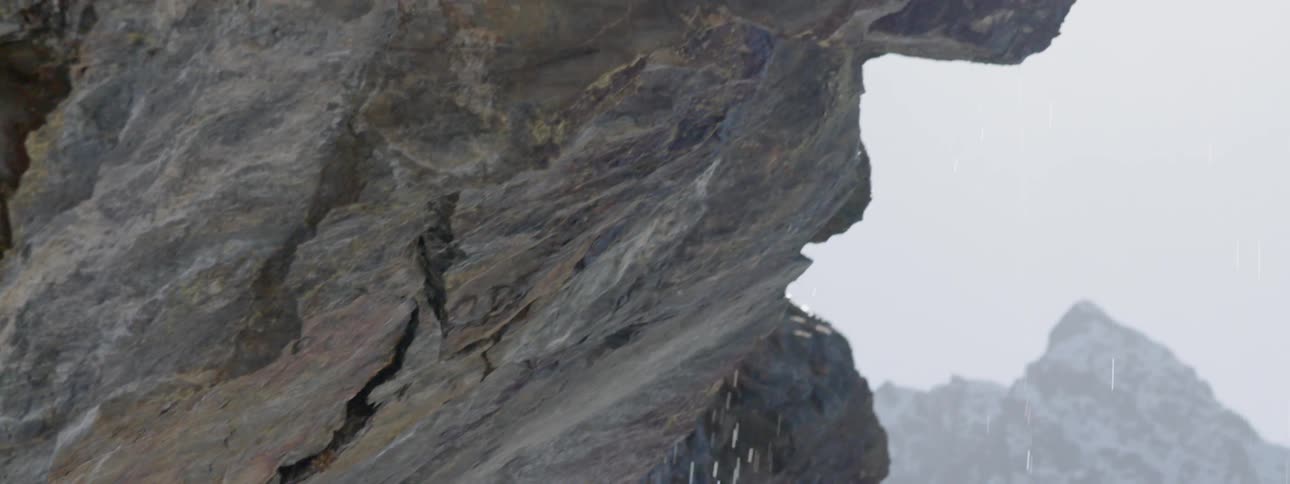 Water drips from a boulder