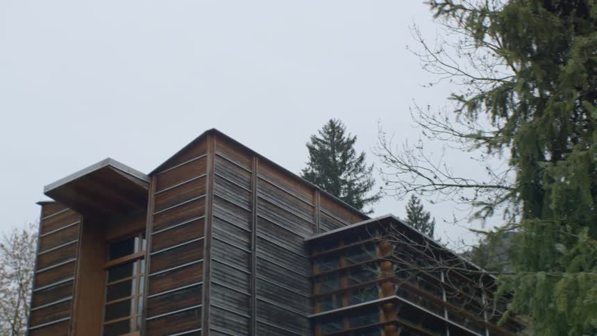 A wooden building surrounded by trees