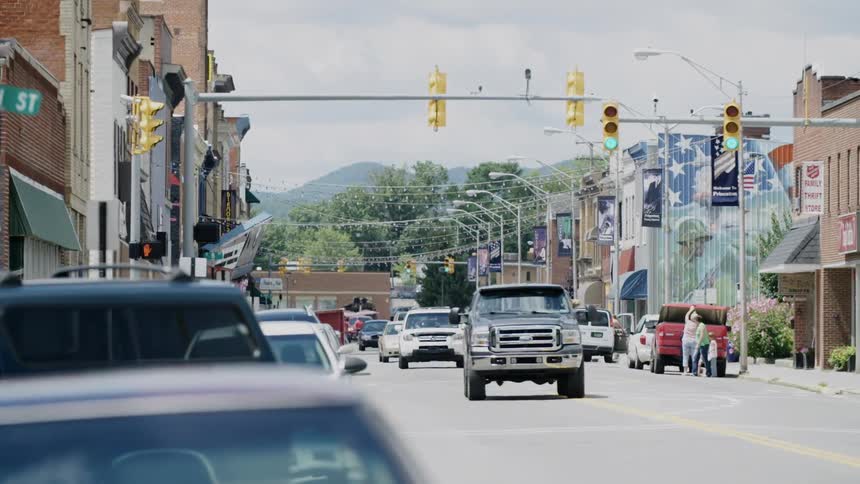Pedestrians and vehicles commute through a city