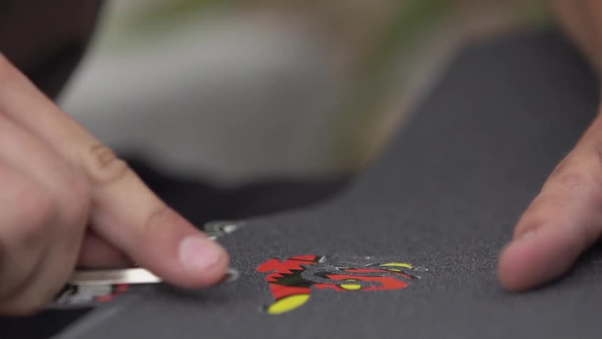 Man applies a decal to a surface