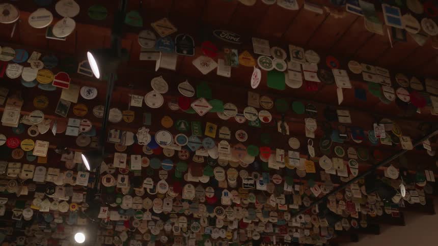 Patches and badges on display as they hang from beams from the ceiling