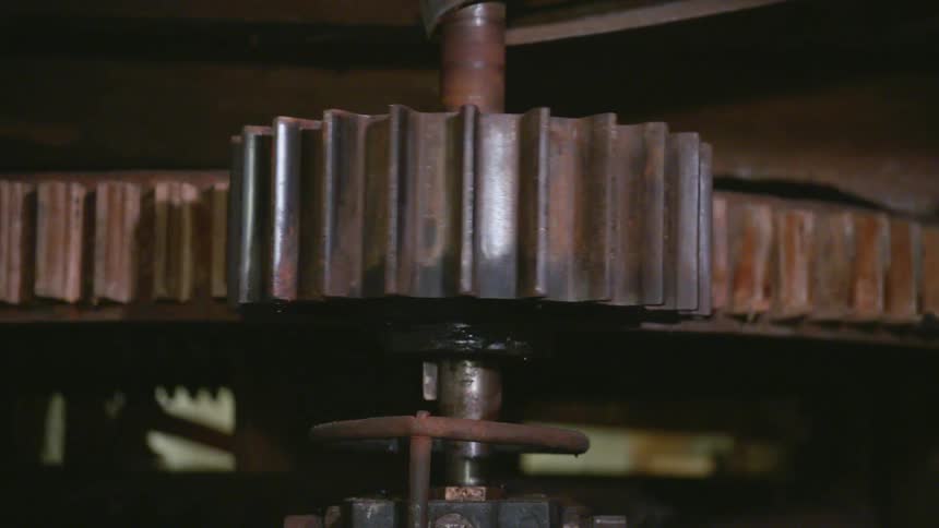 Rusty metal gears spin and rotate