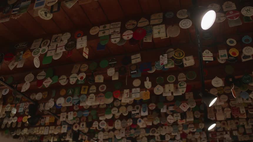 Tags and ribbons hang from wooden ceiling beams