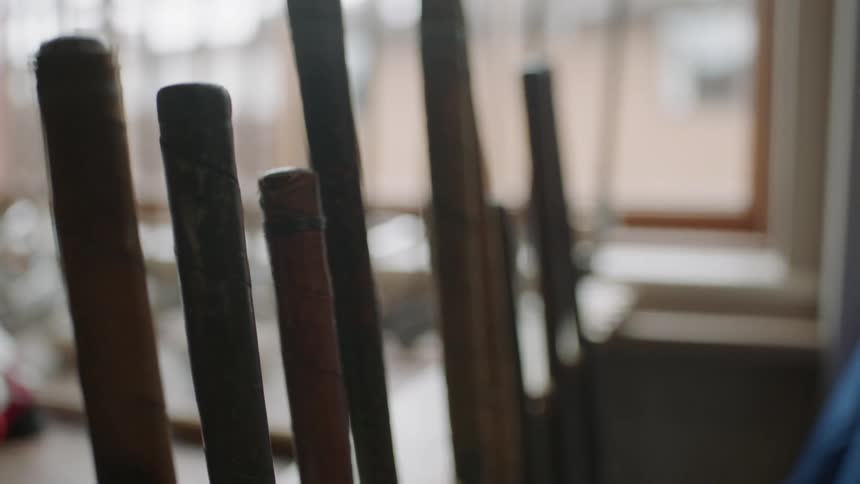 Golf clubs are displayed in a rack