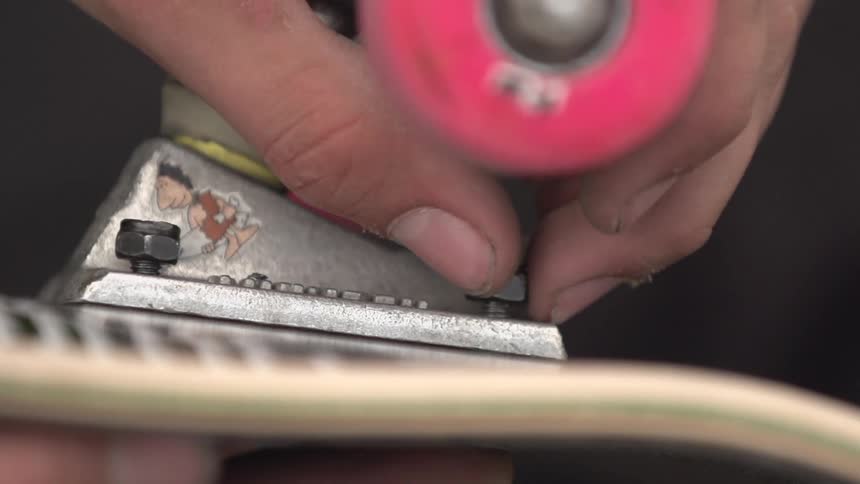 A person tightening up a bolt