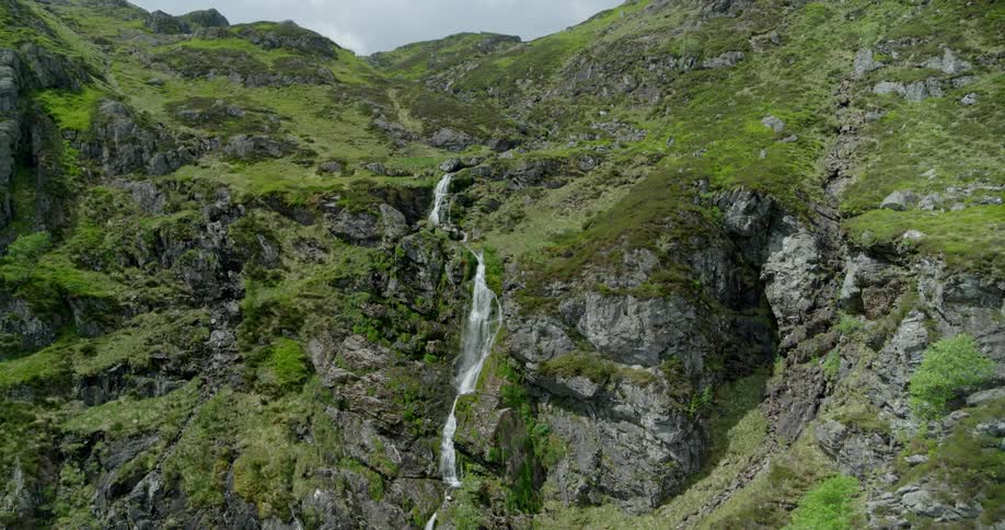 Water flows down the side of a mountain