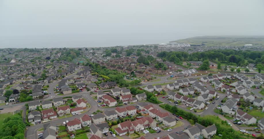 The town is fall of homes and vehicles parked