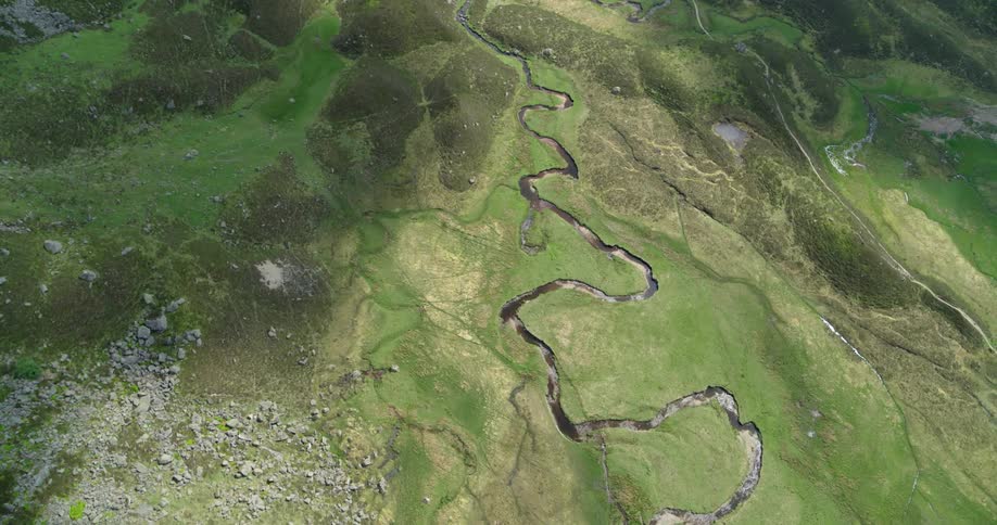 A river winds through a rural field