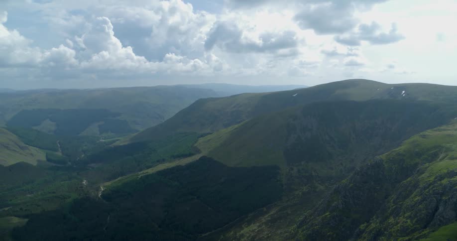 The mountains are vast and covered with green