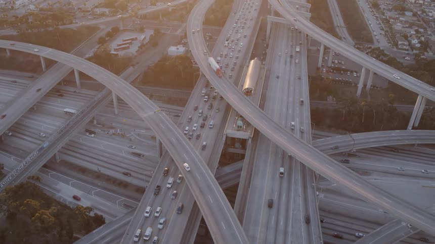 Traffic is backing up on a freeway in the morning