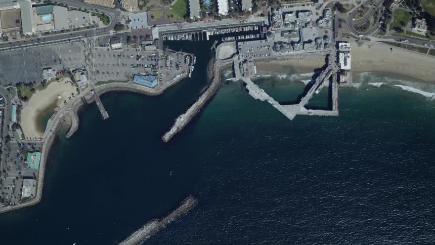 Piers jut out into the ocean along a city's waterfront