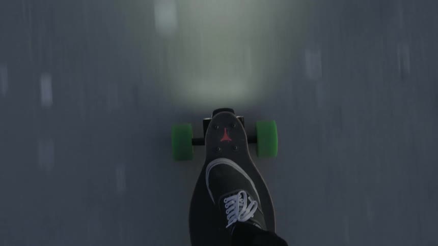 Person skateboards on a sidewalk