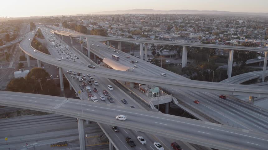 Vehicles travel on a highway overpass