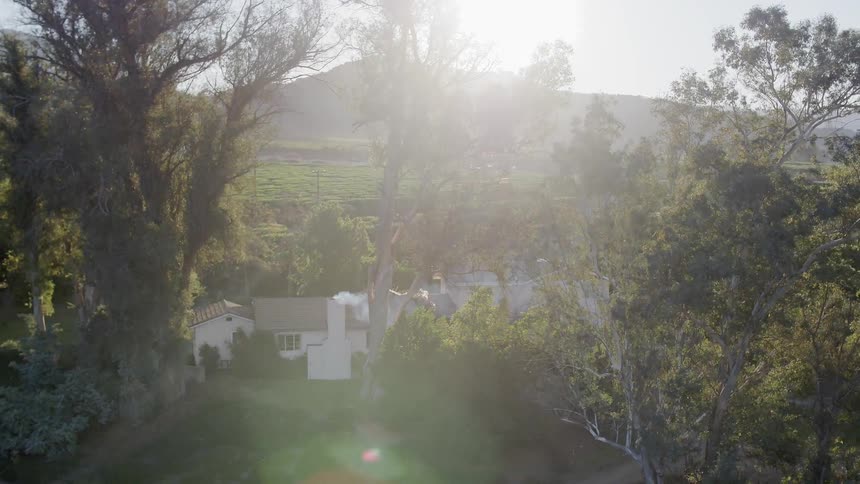 Sunlight shines on a rural house