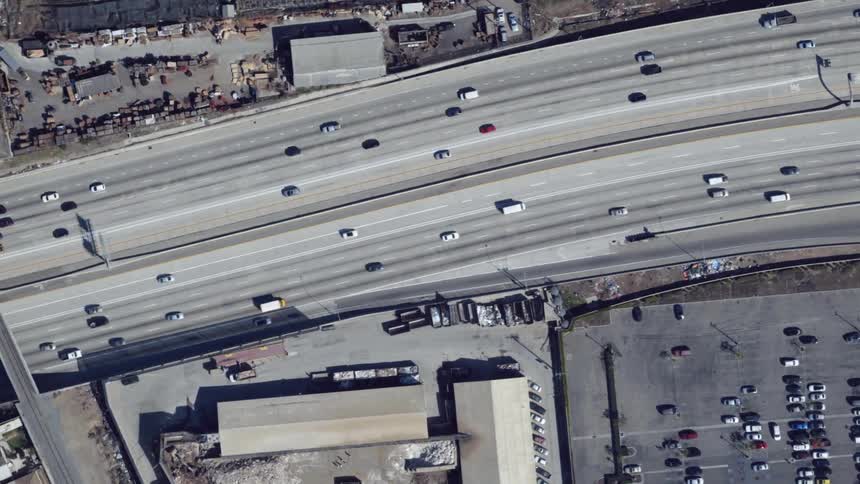 Vehicles travel along a city highway