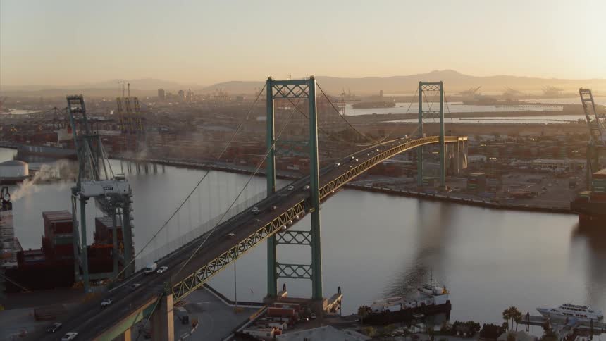 Vehicles travel over a city bridge