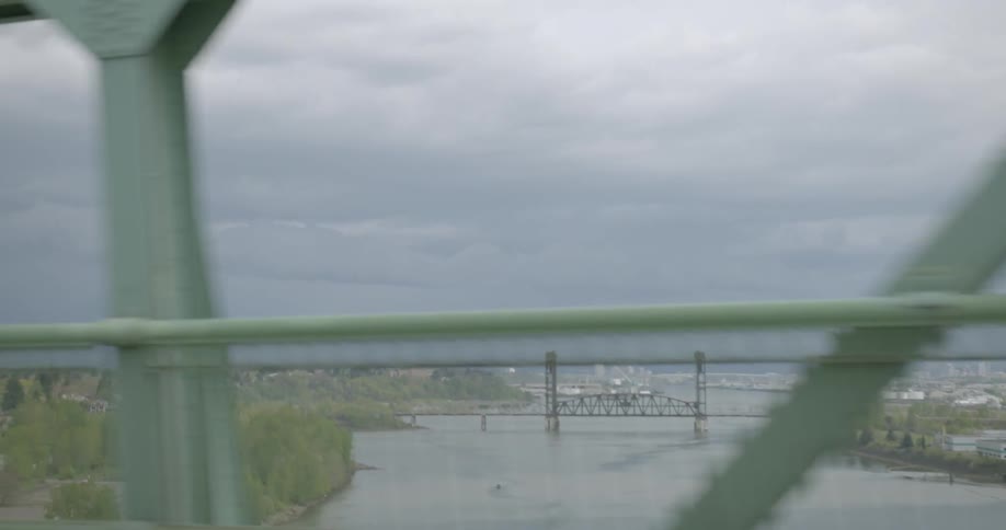 Traveling across a bridge on a cloudy day