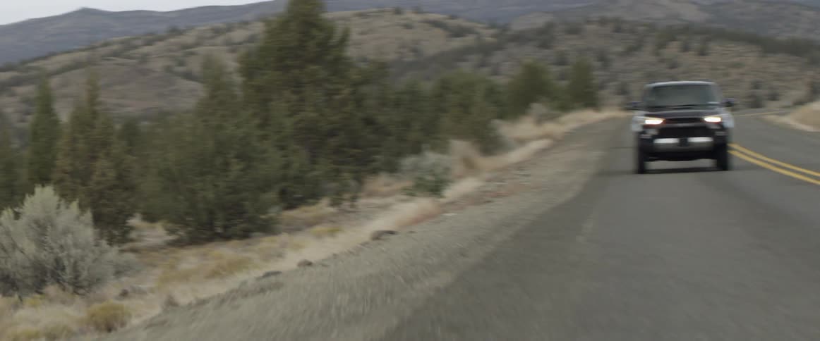 An suv travels a rural road