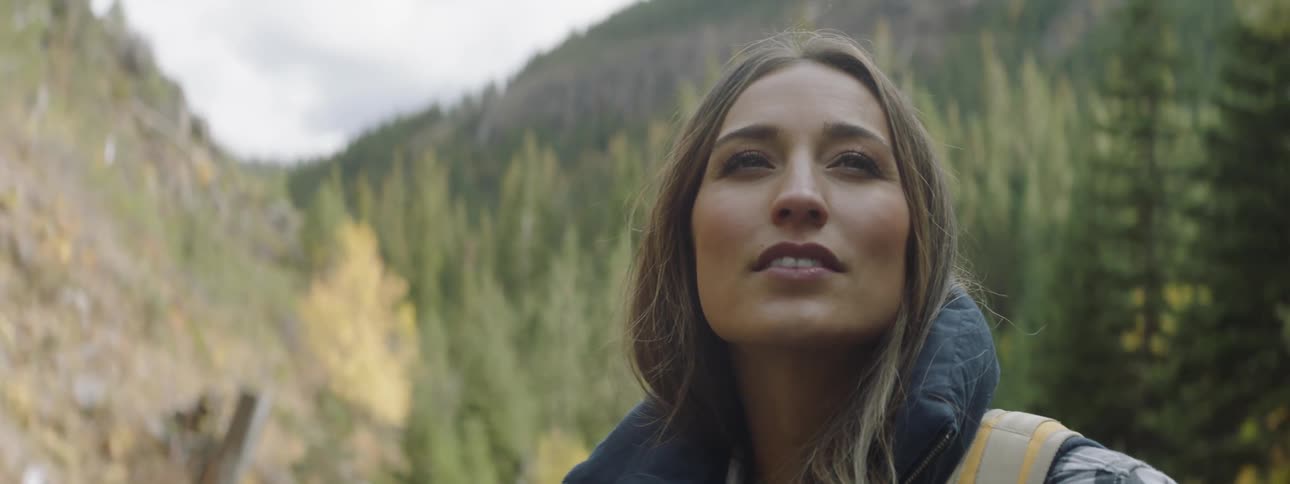 Woman hikes in the mountains