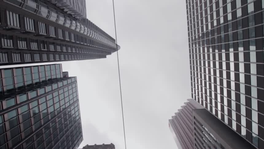 Looking up at large city buildings