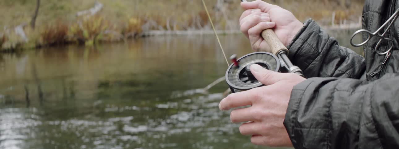 A man fishes in a river