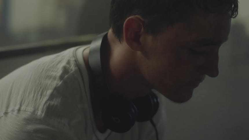 Close up of a man bobbing his head