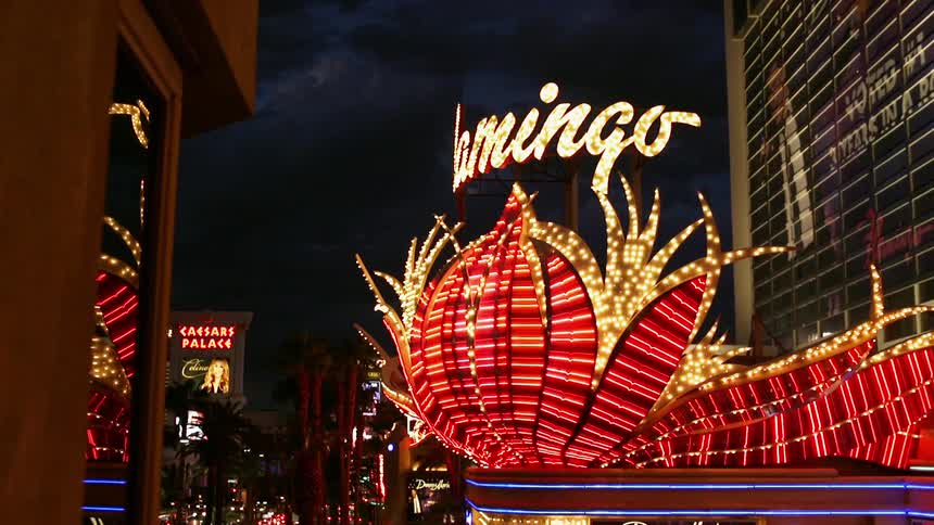 The lights in front of the buildings are flashing at night
