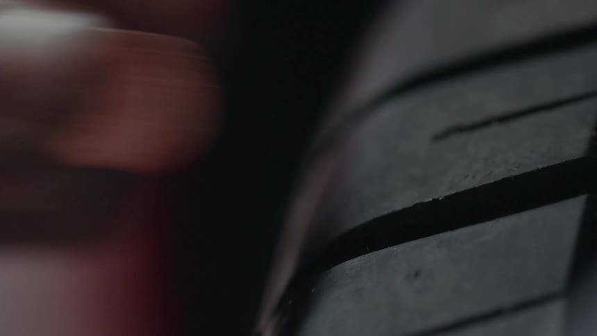 A penny is placed in tire treads