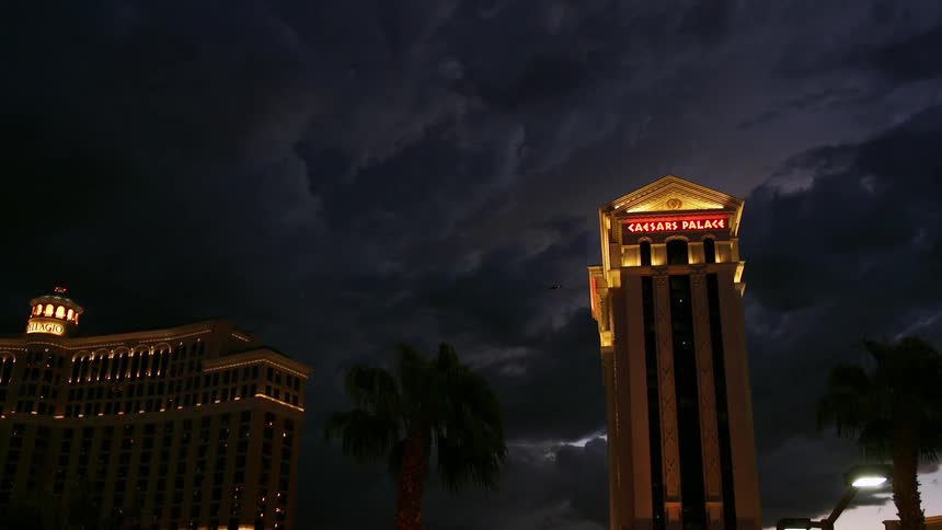 Large buildings against a dark cloudy sky