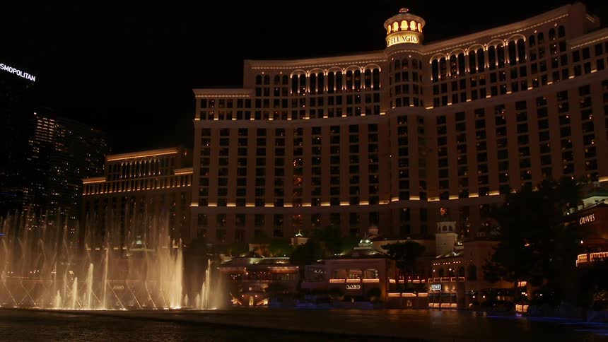 The belladonna hotel and casino water fountain show at night