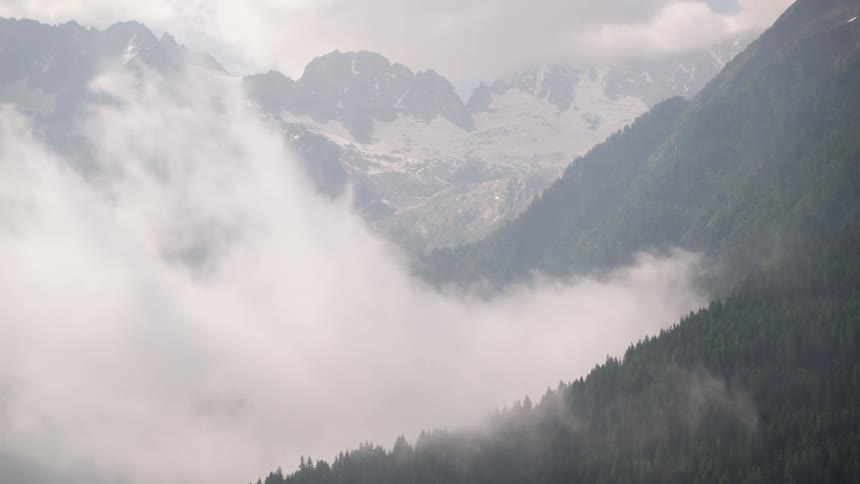 Morning fog floats over a mountain range