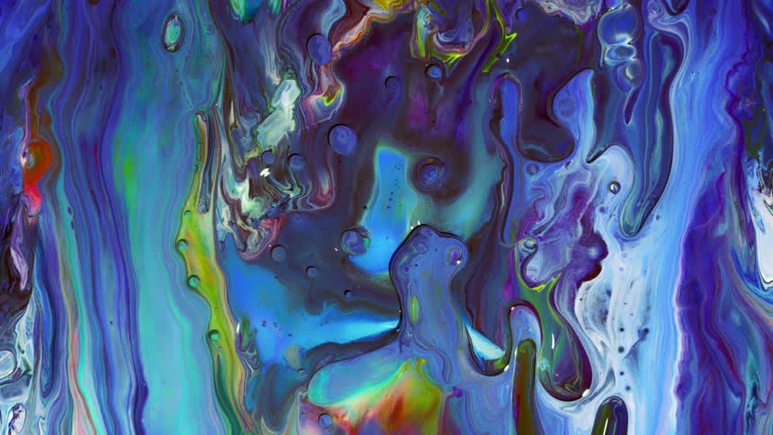 Paint is swirling around on a canvas